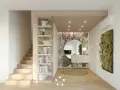 Ingresso moderno con libreria a giorno, carta da parati tropicale, specchio rotondo e verde verticale. Ottime idee ingresso casa.