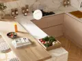 Top cucina laminato: pro e contro. Un piano di lavoro in laminato effetto legno, con ciotola di frutta, libri e sgabelli, in una cucina moderna.