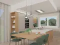 Cucina moderna con isola centrale, tavola in legno e sedie verdi. L'abbinamento colori arredamento crea un ambiente accogliente e luminoso.