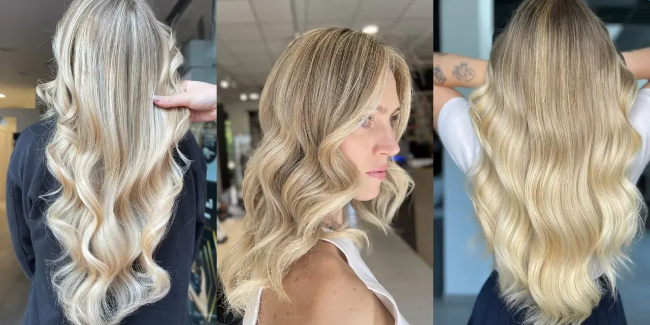 Capelli lunghi e ondulati con sfumature biondo platino, un look radioso e luminoso.