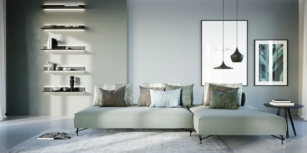 Soggiorno di una casa moderna con divano angolare, quadri e mensole illuminate.