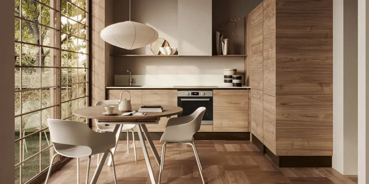 Cucina moderna con mobili in legno di noce e un tavolo rotondo, perfetta per arredare la cucina in modo originale.