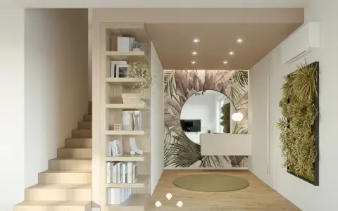 Ingresso moderno con libreria a giorno, carta da parati tropicale, specchio rotondo e verde verticale. Ottime idee ingresso casa.