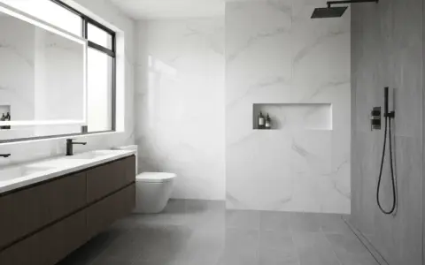 Bagno moderno con doppio lavabo, specchio illuminato, WC e doccia a filo pavimento. Ideale per capire come pulire la doccia e mantenere tutto splendente.