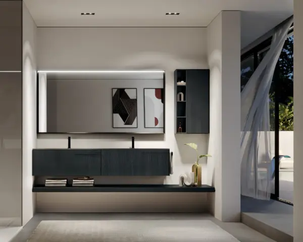 Elegante bagno moderno con mobile sospeso scuro, specchio illuminato e vista su un giardino esterno.
