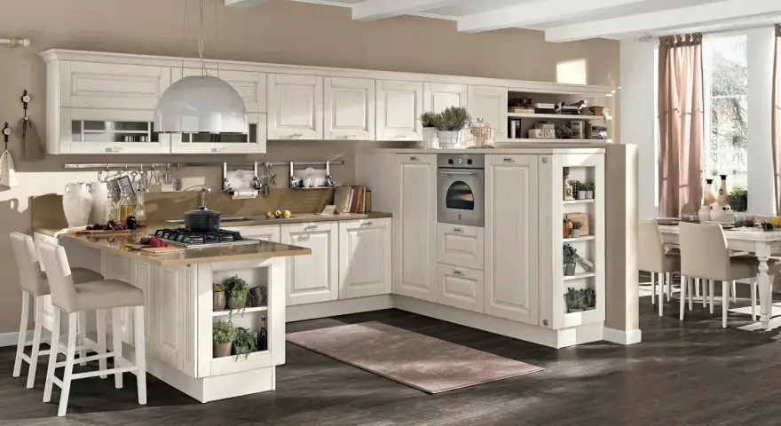 Accogliente cucina stile nordico con isola centrale, mobili chiari e dettagli in legno. Un ambiente luminoso e funzionale.