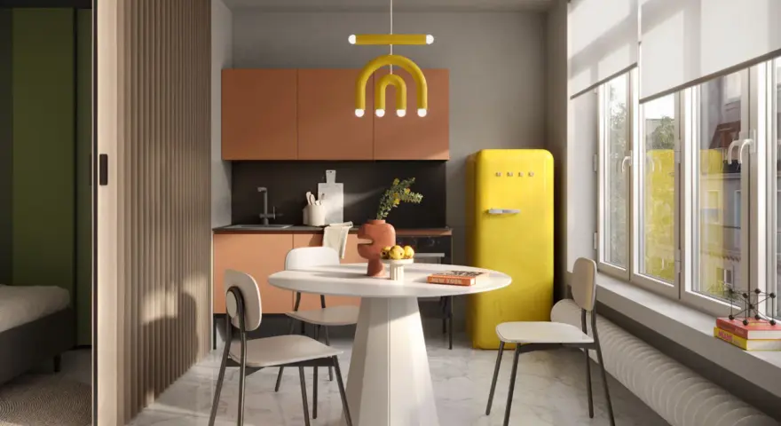 Un'elegante cucina e camera da letto insieme, con un frigorifero giallo acceso, mobili color pesca e una divisoria in legno.