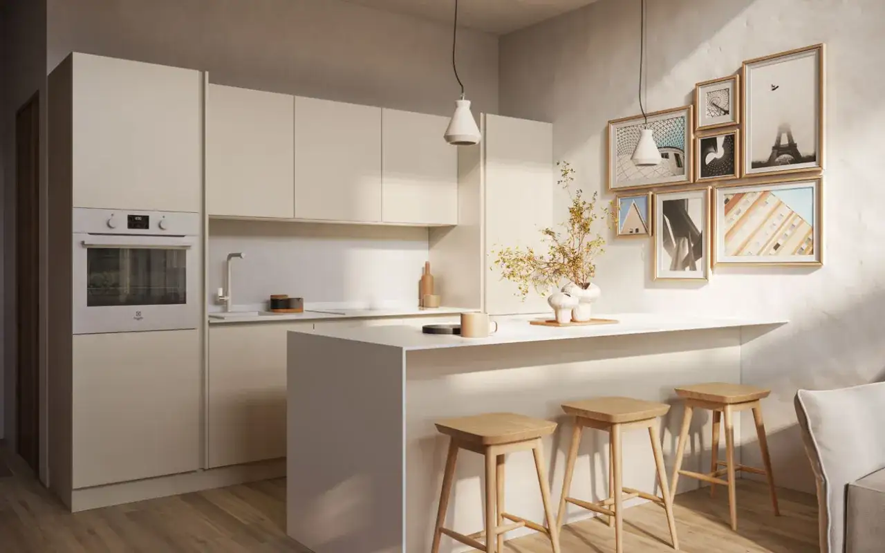 Cucina stile nordico con isola centrale, sgabelli in legno e quadri alle pareti. Luce soffusa crea un'atmosfera accogliente.