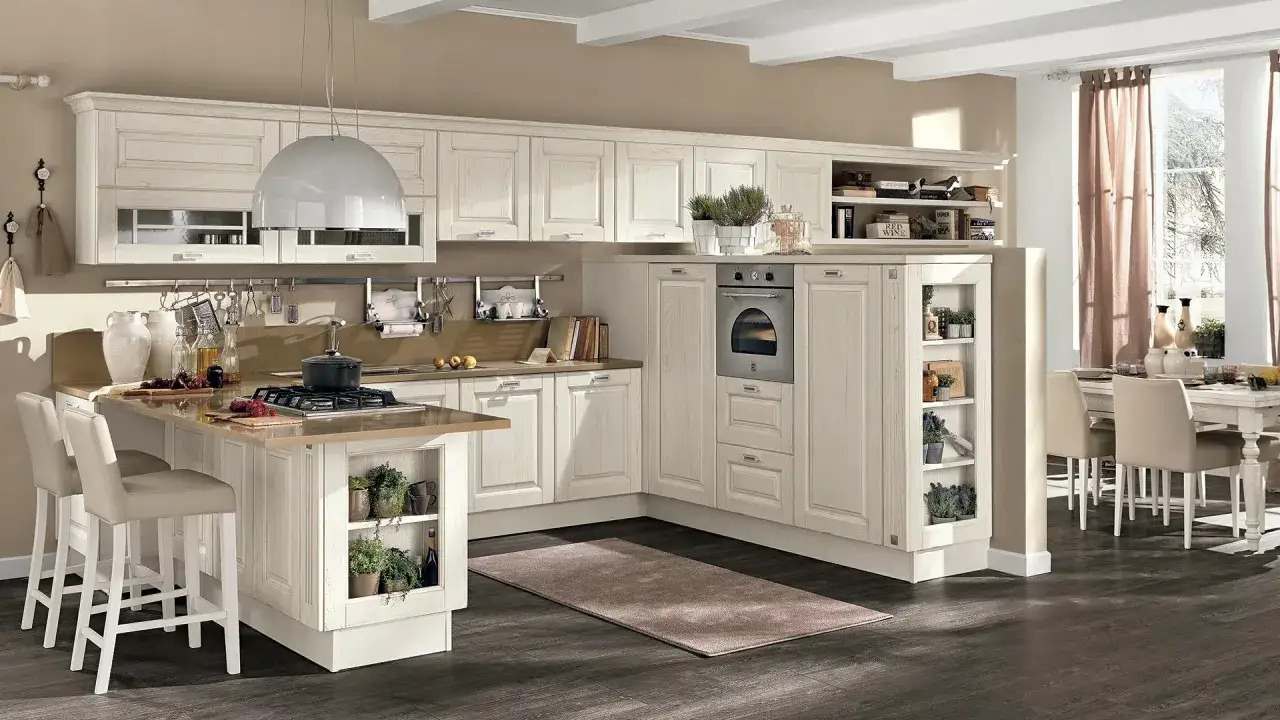 Accogliente cucina stile nordico con isola centrale, mobili chiari e dettagli in legno. Un ambiente luminoso e funzionale.
