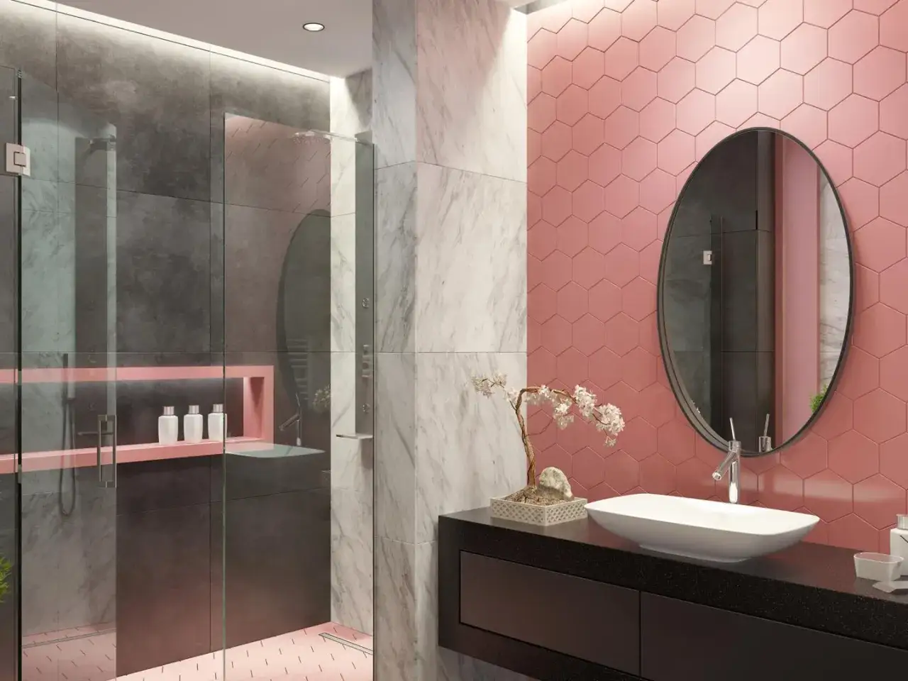 Un bagno moderno con pareti rosa a nido d'ape, doccia in vetro e marmo. Un lavabo ovale su mobile nero e specchio rotondo completano queste idee bagno rosa.